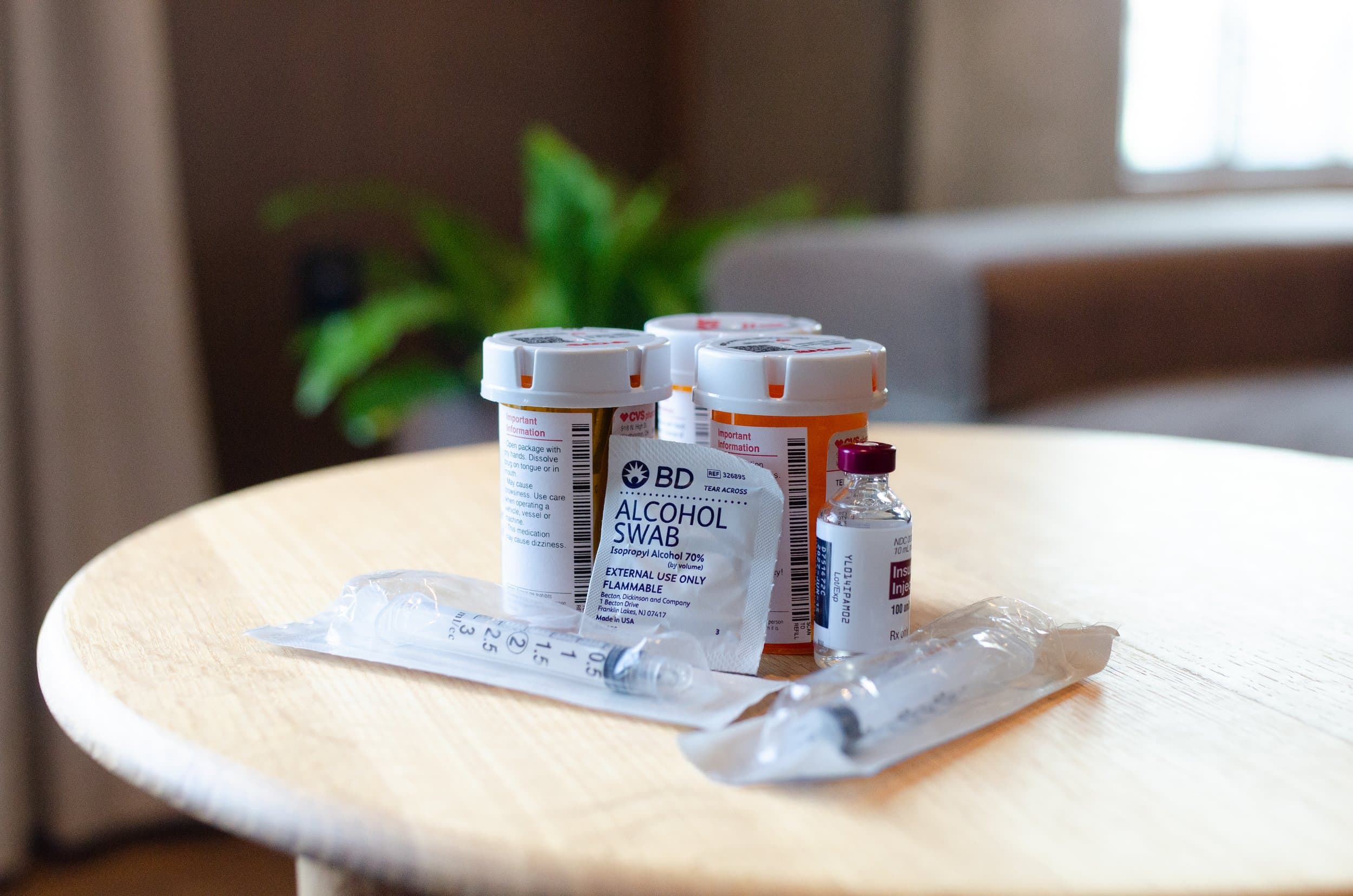 Fertility injection medications and supplies laid out on a table